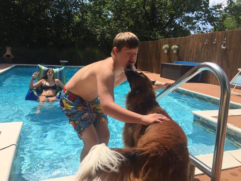 Will swimming with his dog